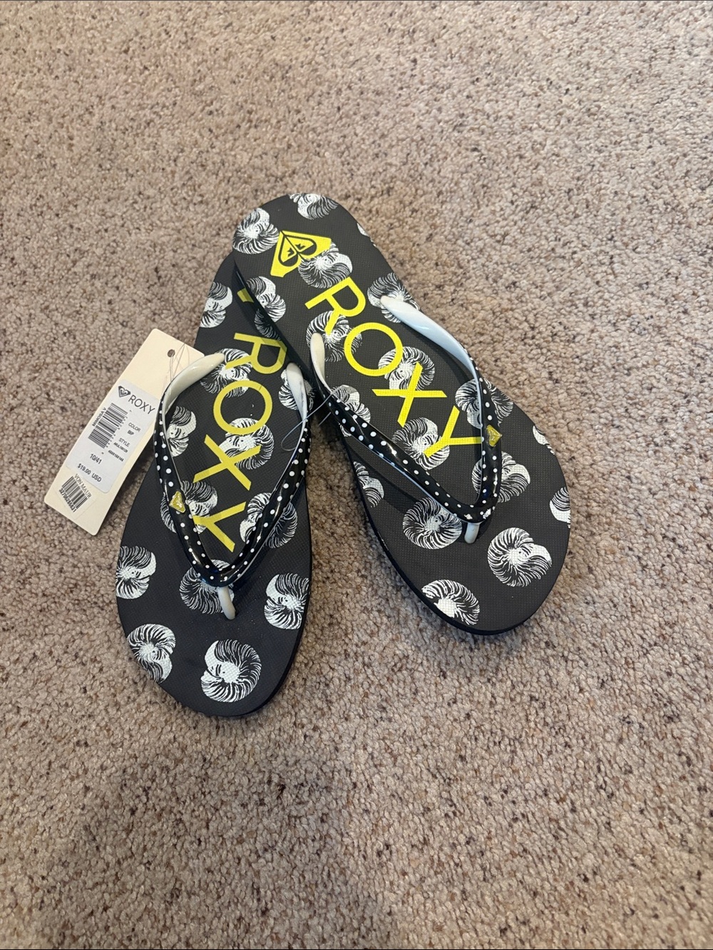 Roxy Black Flip Flops with Yellow Logo and White Shell Motif
